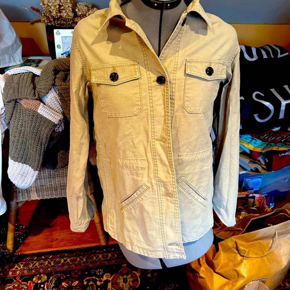Kaki jean jacket with a waist string.